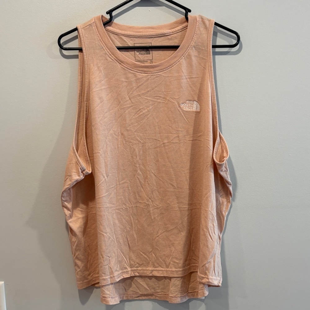 See small spot . Best for xl The North Face Women's Light Pink Muscle Tee